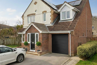 Design ideas for a modern house exterior in Devon.