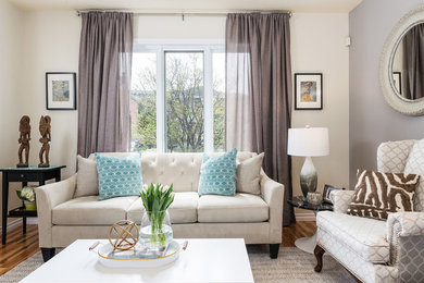 Example of a mid-sized transitional open concept light wood floor living room design in Montreal with yellow walls, a standard fireplace, a wood fireplace surround and no tv