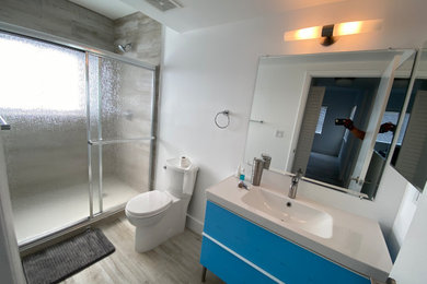 Inspiration for a mid-sized contemporary kids' gray tile and porcelain tile single-sink bathroom remodel with flat-panel cabinets, white cabinets, quartzite countertops, white countertops and a freestanding vanity