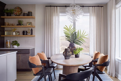 Kitchen/dining room combo - mid-sized transitional light wood floor and beige floor kitchen/dining room combo idea in Denver with white walls