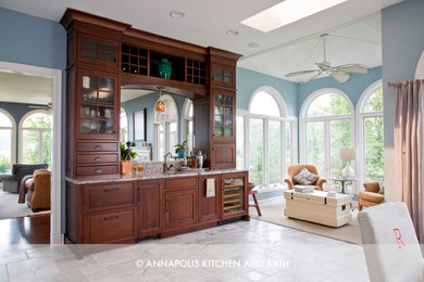 Elegant kitchen photo in Baltimore with raised-panel cabinets and brown cabinets