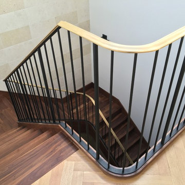 Walnut Stairs with Bronze Handrail and Iron Balusters
