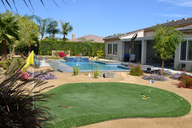 Photo of a mid-sized modern full sun backyard landscaping in Los Angeles with decking.