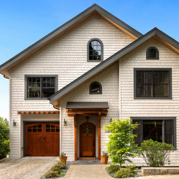 Exterior makeover with stained cedar shake siding and wood accents