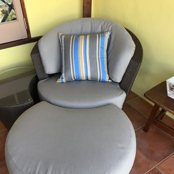 Custom glider cushions and pillows brighten outdoor patio space