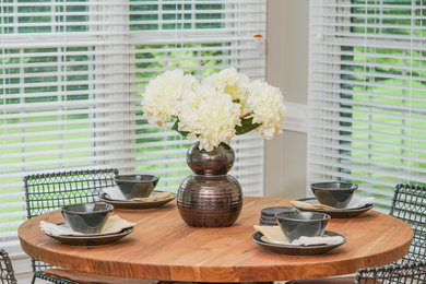 This is an example of a contemporary dining room in Raleigh.