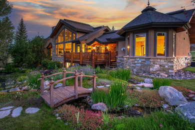 Example of a huge mountain style home design design in Denver
