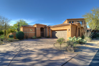 Example of a tuscan exterior home design in Phoenix