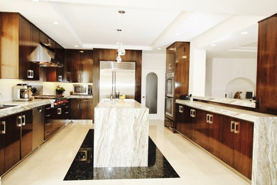 Example of a mid-sized trendy u-shaped marble floor eat-in kitchen design in Los Angeles with a double-bowl sink, flat-panel cabinets, dark wood cabinets, granite countertops, white backsplash, stainless steel appliances and an island