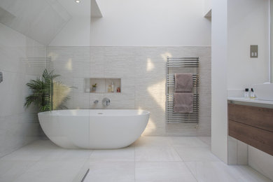 Contemporary bathroom in Other with a freestanding bath, a walk-in shower, a trough sink and an open shower.