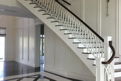 Elegant White Staircase with Wood Railing