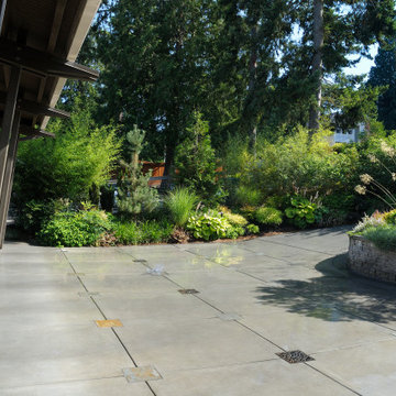 Vehicle court with decorative stone inlay and grates