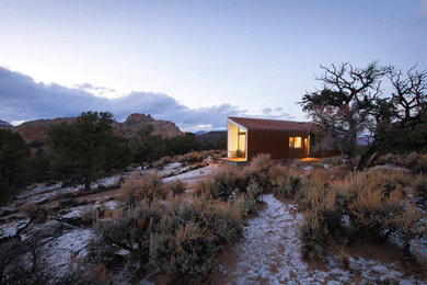 Inspiration for a small contemporary one-story metal exterior home remodel in Salt Lake City with a shed roof