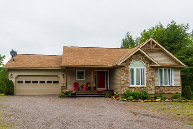 Mid-sized elegant multicolored one-story mixed siding exterior home photo in Toronto with a shingle roof