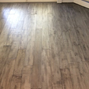 Custom Chevron pattern hand scraped Acacia stained metallic charcole