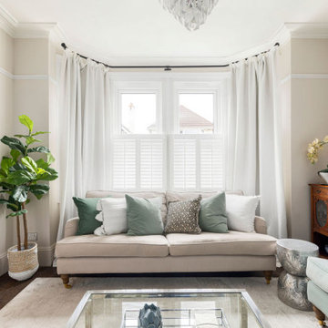 Calm & serene living room with a mix of chrome & brass metal accents