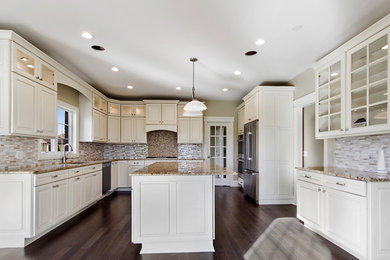 Large elegant u-shaped dark wood floor and brown floor open concept kitchen photo in Chicago with an undermount sink, raised-panel cabinets, white cabinets, granite countertops, multicolored backsplash, matchstick tile backsplash, stainless steel appliances, an island and gray countertops