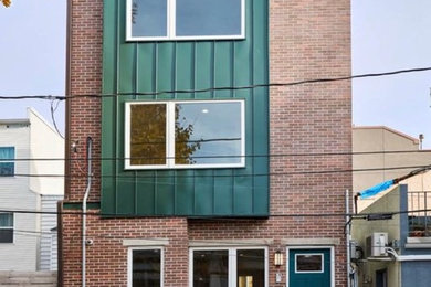 Example of a classic three-story metal townhouse exterior design in Philadelphia