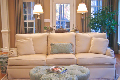 Living room - mid-sized traditional formal and enclosed medium tone wood floor living room idea in Other with beige walls, no fireplace and a wall-mounted tv