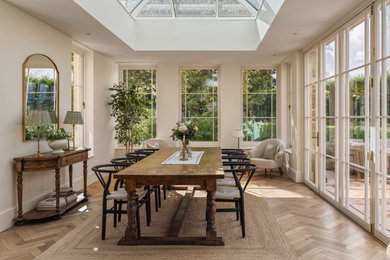 Inspiration for a traditional conservatory in Surrey with a skylight, brown floors and medium hardwood flooring.