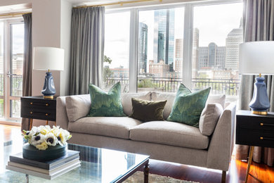 Inspiration for a mid-sized transitional open concept medium tone wood floor and brown floor living room remodel in Boston with beige walls