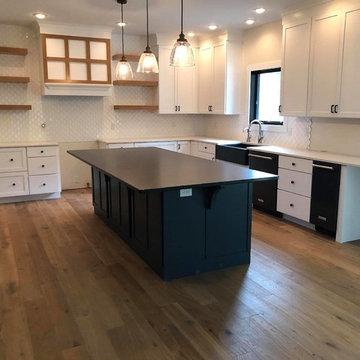 Absolute Black Honed Granite Island and Ellipse Olympus White Quartz Counters