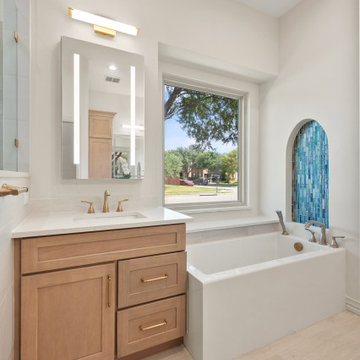 Vertical View of Light Oak Vanity, LED Mirror, Large Picture Window, and Soaking