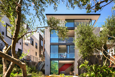 Large minimalist four-story wood exterior home photo in San Francisco