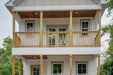 Transitional white two-story wood exterior home photo in Nashville