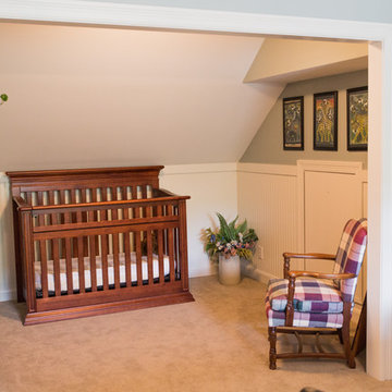 Sloped ceiling and headboard paneling in converted attic space