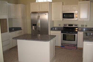 Example of a farmhouse kitchen design in Burlington