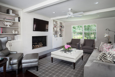 Example of a large trendy formal and enclosed dark wood floor and black floor living room design in Austin with gray walls, a standard fireplace, a brick fireplace and a wall-mounted tv