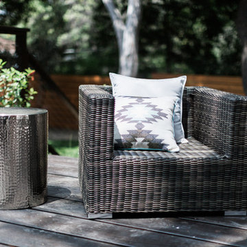 Outdoor Sectional Sofa and Chair with Brass Table on Deck with Wood Horizontal P