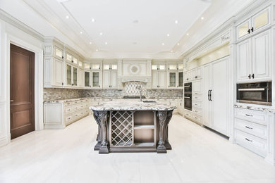 Large elegant u-shaped marble floor and white floor enclosed kitchen photo in Toronto with an undermount sink, raised-panel cabinets, white cabinets, granite countertops, multicolored backsplash, matchstick tile backsplash, paneled appliances, an island and multicolored countertops