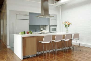 Example of a trendy kitchen design in New York with an island