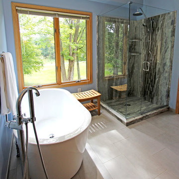 Master Bathroom with Free Standing Tub, Quartz Countertop and Grey Tiled Shower