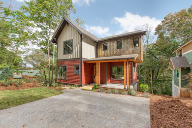 Mid-sized craftsman three-story mixed siding house exterior idea in Other
