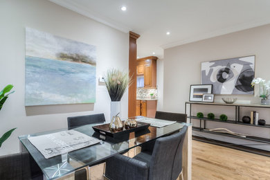 Example of a mid-century modern dining room design in Toronto