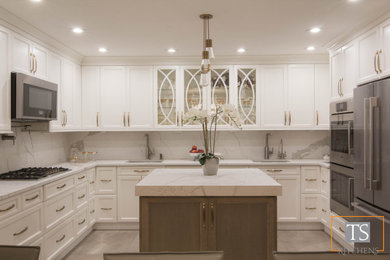 Inspiration for a large transitional u-shaped eat-in kitchen in New York with an undermount sink, recessed-panel cabinets, white cabinets, quartzite benchtops, red splashback, stone slab splashback, stainless steel appliances, porcelain floors, with island, grey floor and white benchtop.