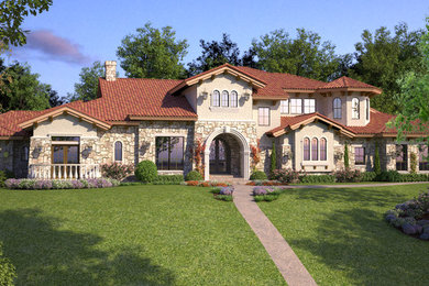Design ideas for a large two-storey exterior in Dallas with stone veneer.