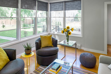 Example of a mid-sized trendy open concept medium tone wood floor family room design in Boston