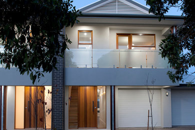 Contemporary two-storey grey duplex exterior in Adelaide with a gable roof.