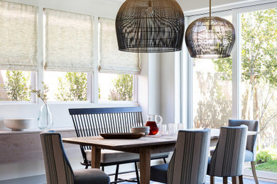 Dining room - mid-sized transitional dining room idea in Orange County with white walls