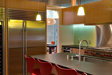 Inspiration for a contemporary kitchen remodel in San Francisco with an undermount sink, flat-panel cabinets, medium tone wood cabinets, stainless steel appliances and an island
