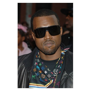 Kanye West (Wearing A Louis Vuitton Scarf) At Arrivals For Mission