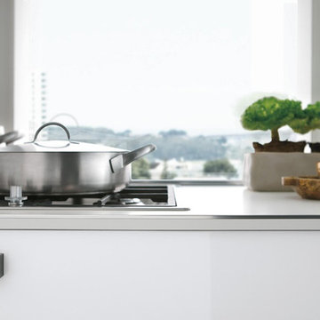 Modern white high gloss kitchen with curved cabinets