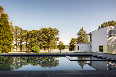 Example of a minimalist white exterior home design in New York