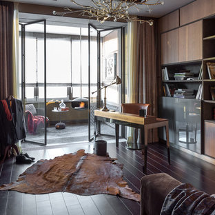 Design ideas for a mid-sized contemporary study room in Moscow with brown walls, dark hardwood floors, a freestanding desk and brown floor.