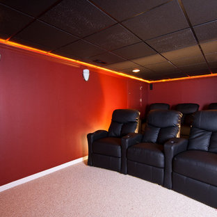 Design ideas for a large classic open plan home cinema in Newark with red walls, carpet and a built-in media unit.