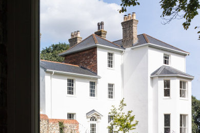 Inspiration for a large traditional house exterior in Other.